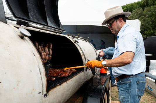 Goode Co. Pitmaster smoking some flavorful BBQ meats with Goode Co BBQ sauces and rubs.